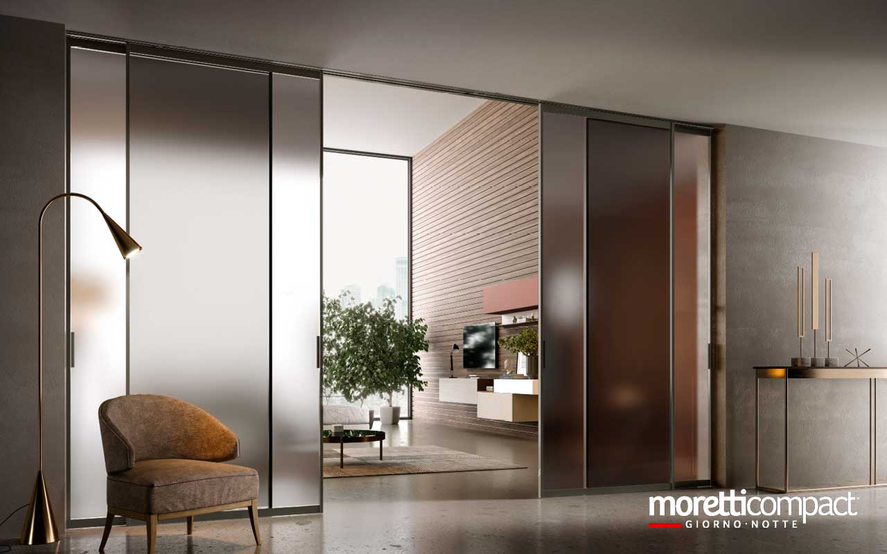 Portale ad ante scorrevoli con binario incassato a soffitto